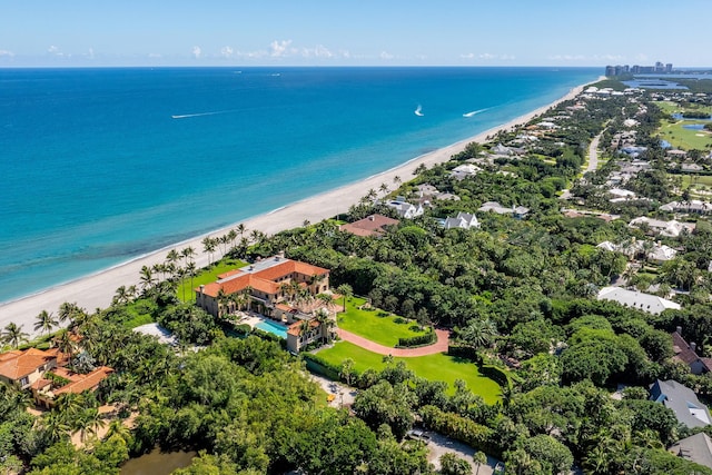 bird's eye view featuring a water view and a view of the beach