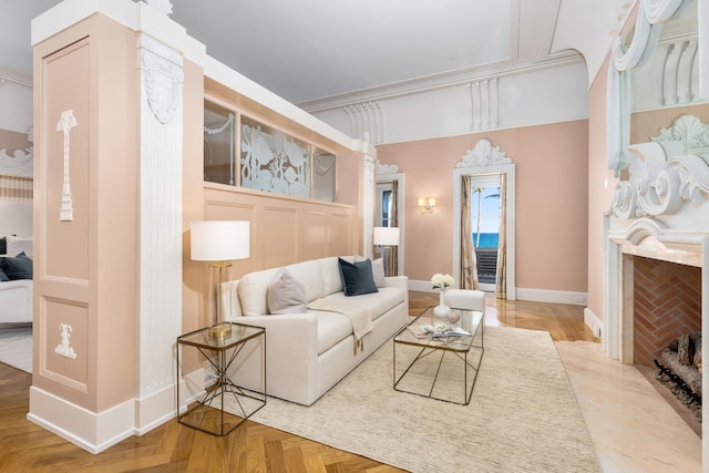 living room featuring parquet floors and ornamental molding