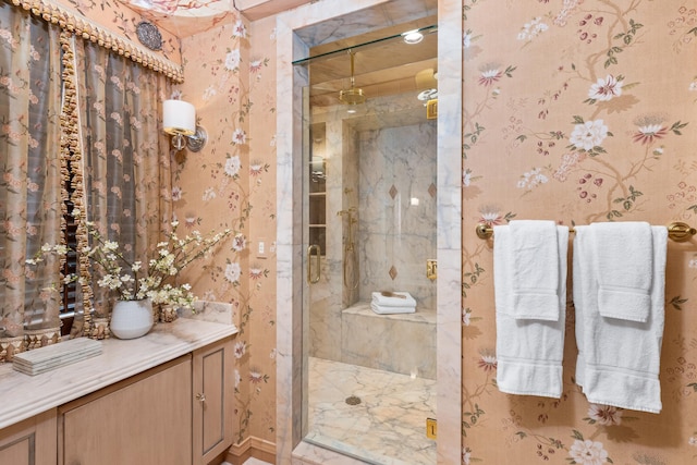 bathroom featuring a shower with shower door