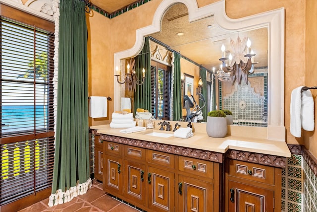 bathroom with vanity and a chandelier