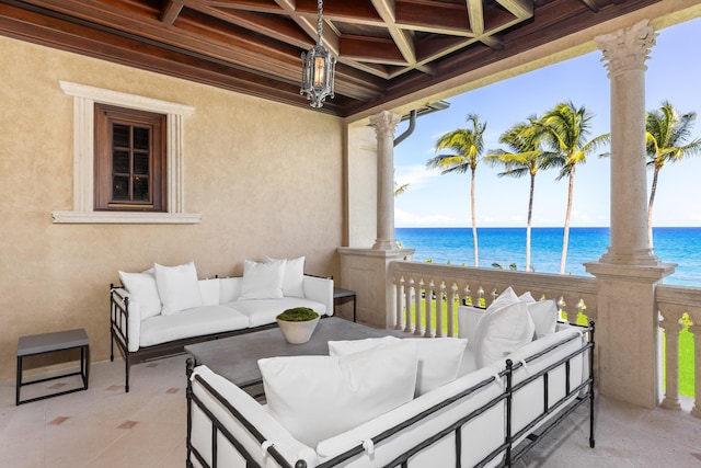 view of patio featuring outdoor lounge area and a water view