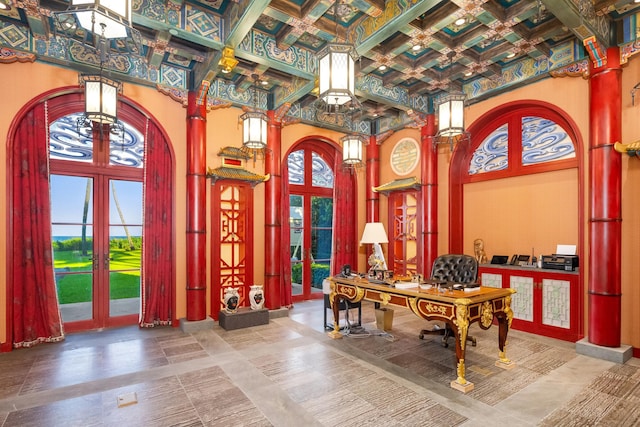 home office with plenty of natural light, beam ceiling, french doors, and coffered ceiling