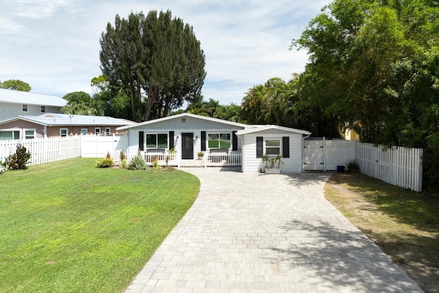 rear view of property featuring a yard