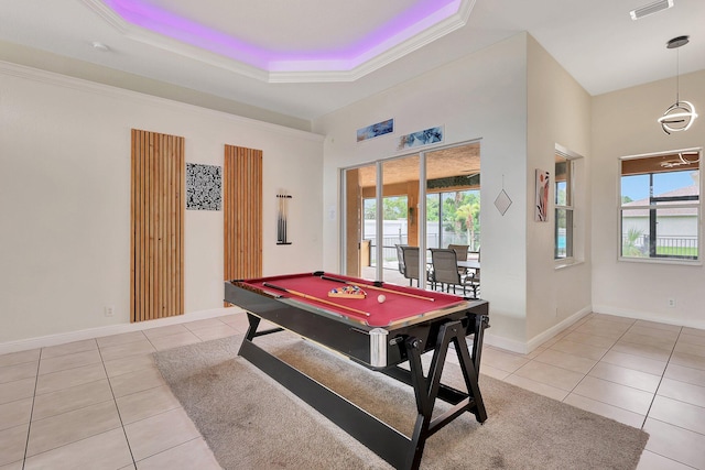 game room featuring pool table, crown molding, a tray ceiling, and light tile patterned floors