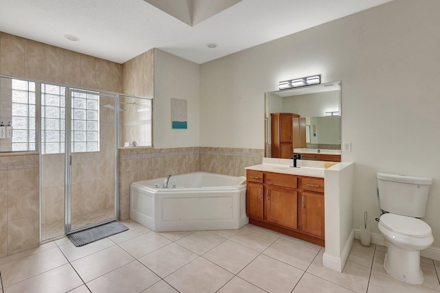 full bathroom with vanity, separate shower and tub, toilet, and tile patterned floors