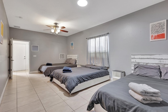 tiled bedroom with ceiling fan