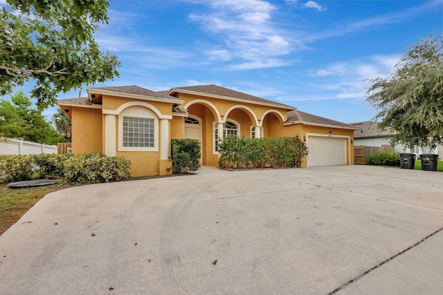 mediterranean / spanish house featuring a garage