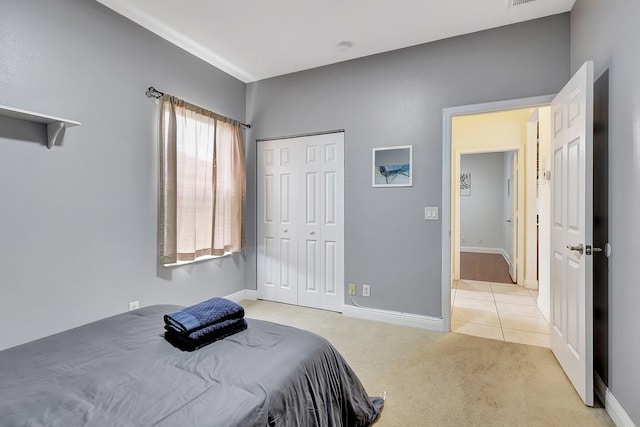 carpeted bedroom with a closet