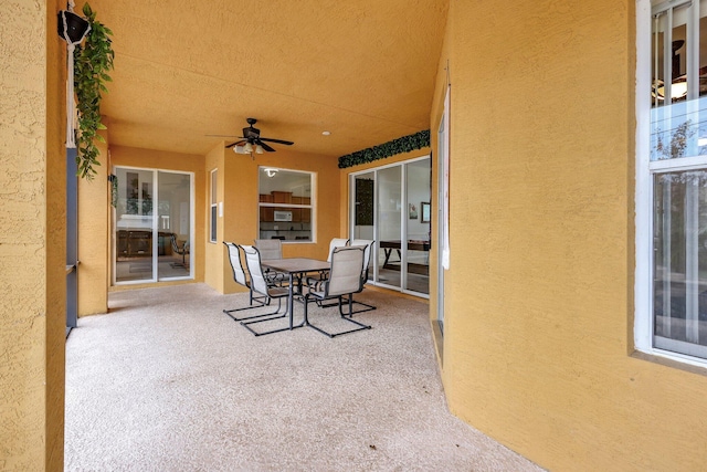 view of patio featuring ceiling fan