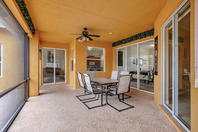 sunroom / solarium with ceiling fan