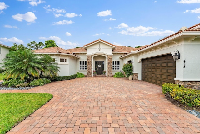 mediterranean / spanish-style home featuring a garage