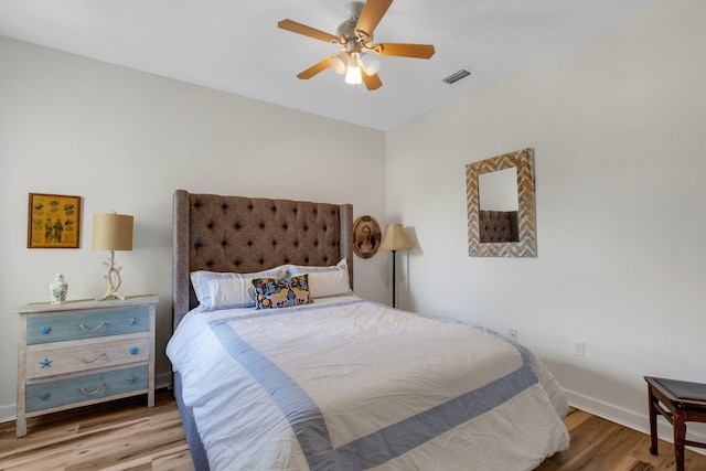 bedroom featuring ceiling fan and wood-type flooring