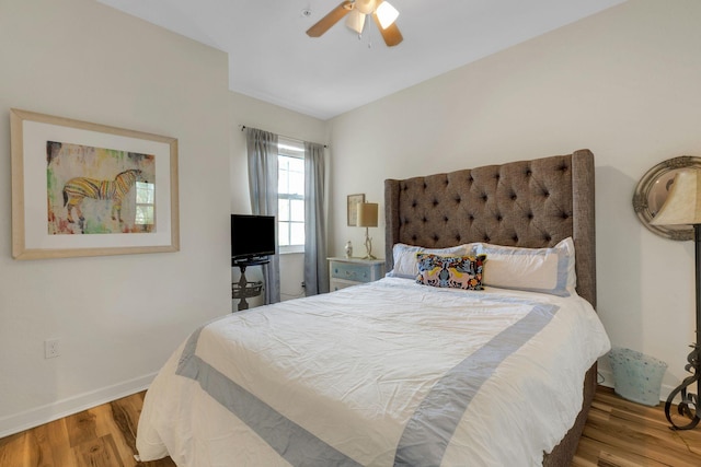 bedroom with ceiling fan and light hardwood / wood-style flooring