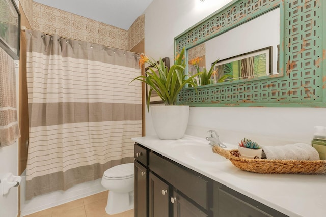 full bathroom featuring tile patterned flooring, vanity, toilet, and shower / bath combination with curtain