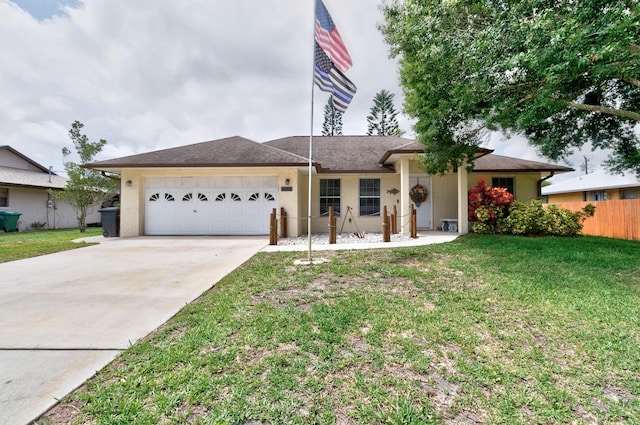 single story home featuring a front lawn and a garage