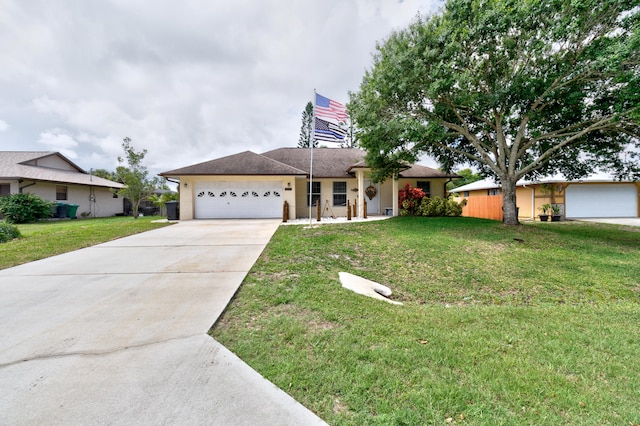 ranch-style home with a front yard and a garage