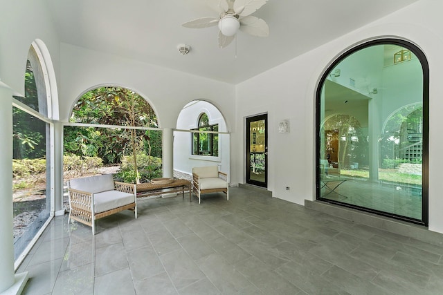 interior space featuring ceiling fan