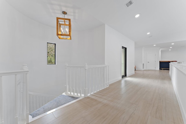 corridor featuring light hardwood / wood-style floors