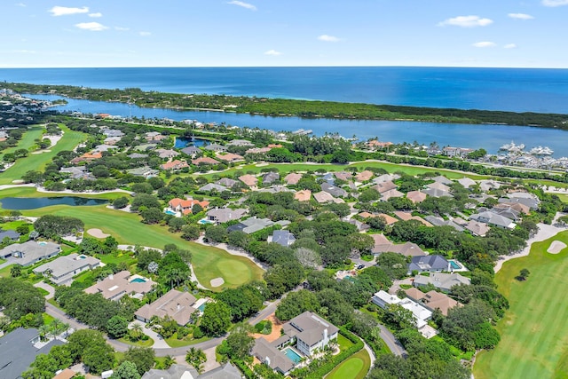 bird's eye view with view of golf course, a water view, and a residential view