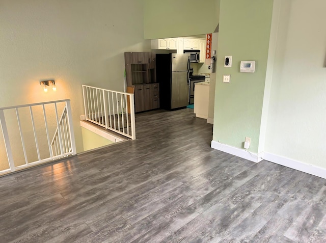 unfurnished room featuring dark hardwood / wood-style floors