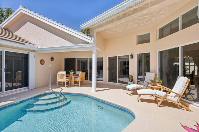 view of swimming pool featuring a patio area