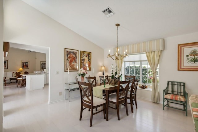 dining room featuring light hardwood / wood-style flooring, ceiling fan with notable chandelier, and vaulted ceiling