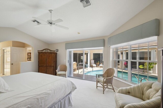 carpeted bedroom featuring ceiling fan, access to outside, and vaulted ceiling