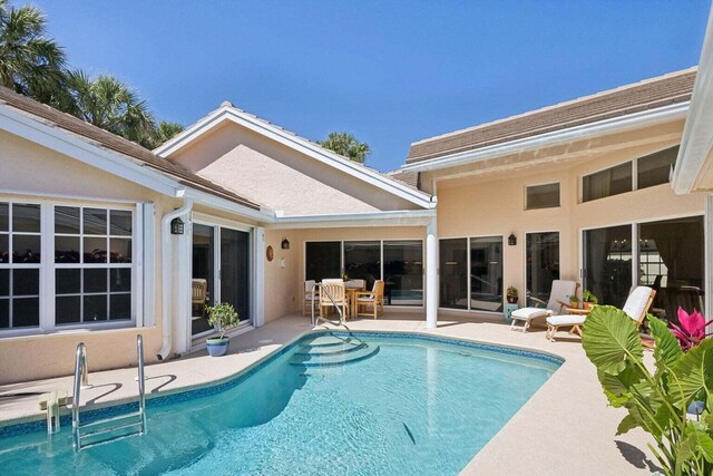 view of pool featuring a patio area