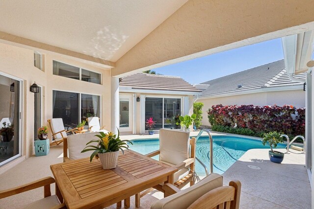 view of swimming pool with a patio area