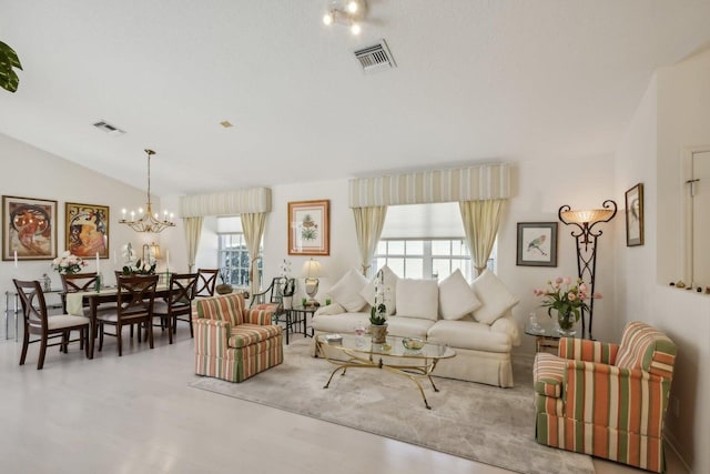 living room featuring plenty of natural light, a chandelier, and vaulted ceiling