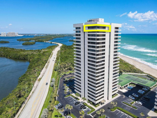 birds eye view of property with a water view