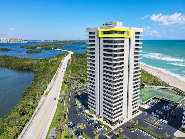 aerial view with a view of the beach and a water view