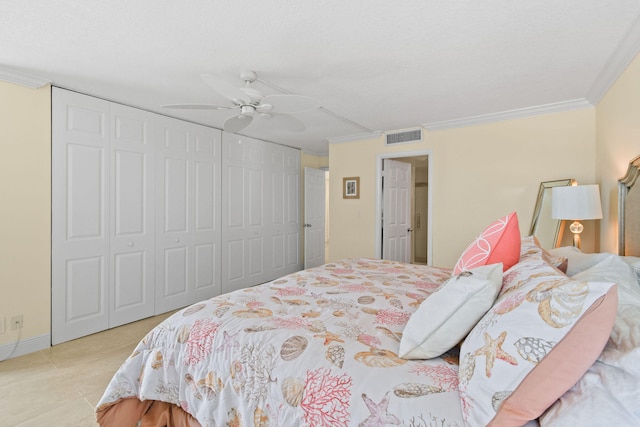 bedroom with ceiling fan, ornamental molding, and light tile patterned floors