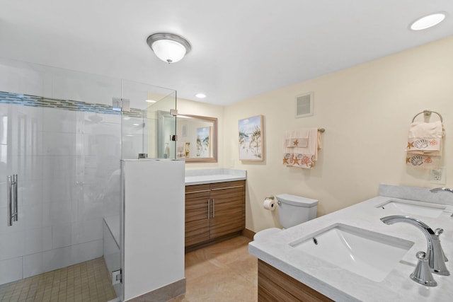 bathroom with vanity, an enclosed shower, and toilet