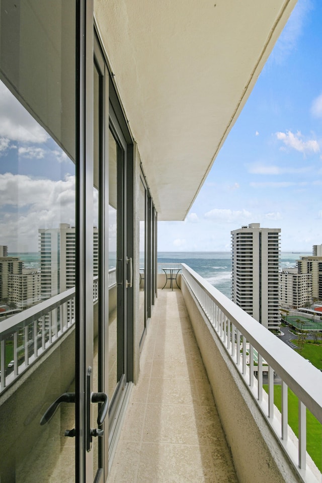 balcony featuring a water view