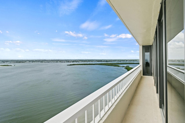 balcony featuring a water view