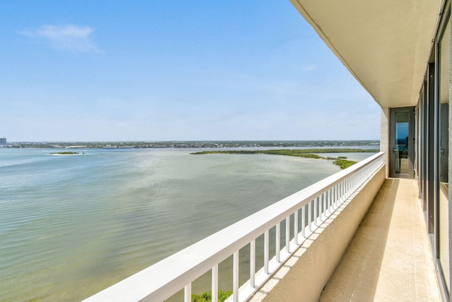 balcony featuring a water view