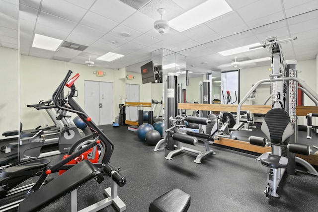 gym featuring visible vents and a paneled ceiling