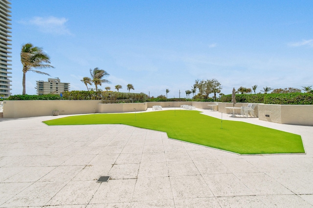 view of property's community with a patio area