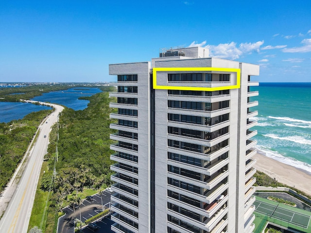 exterior space with a beach view and a water view