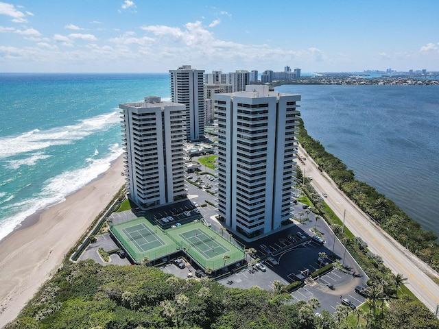 birds eye view of property with a view of the beach and a water view