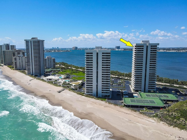 bird's eye view featuring a view of the beach and a water view