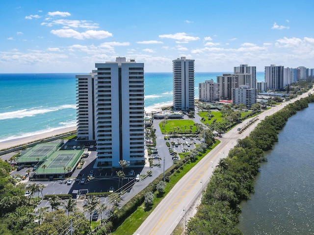 drone / aerial view with a city view and a water view