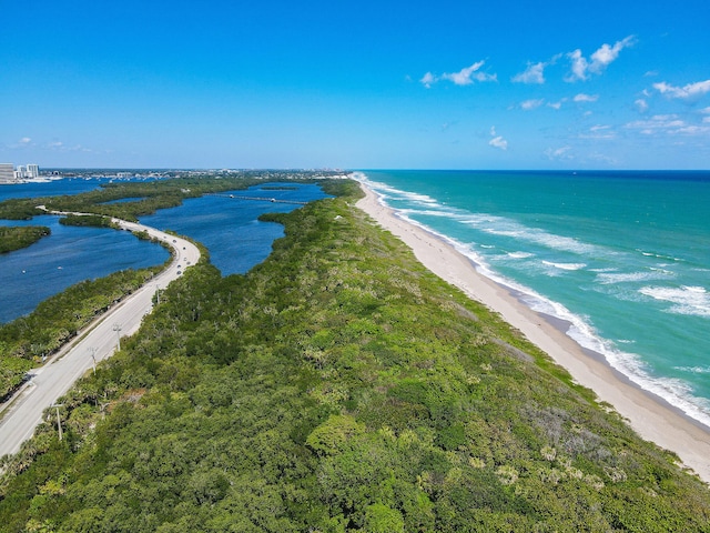 aerial view featuring a view of the beach and a water view