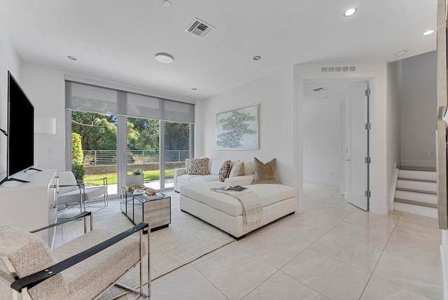 living room with light tile patterned flooring