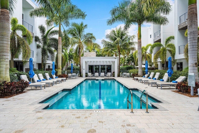 view of swimming pool with a patio