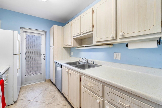 kitchen with sink, light brown cabinets, stainless steel dishwasher, white fridge, and light tile patterned floors