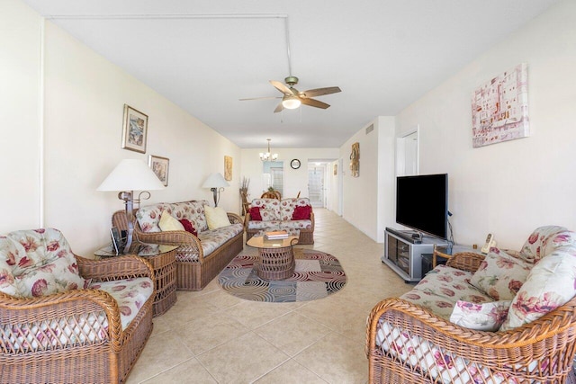 living room featuring ceiling fan with notable chandelier and light tile patterned flooring