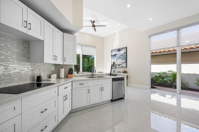 kitchen with white cabinetry, sink, ceiling fan, black electric cooktop, and stainless steel dishwasher