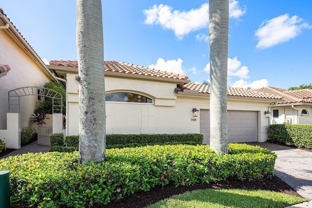 mediterranean / spanish-style house featuring a garage